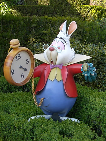 White Rabbit Statue Holding Pocket Watch In Green Garden