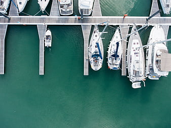 Aerial view of luxury yachts docked at a marina