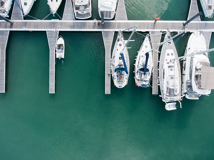 Aerial view of luxury yachts docked at a marina