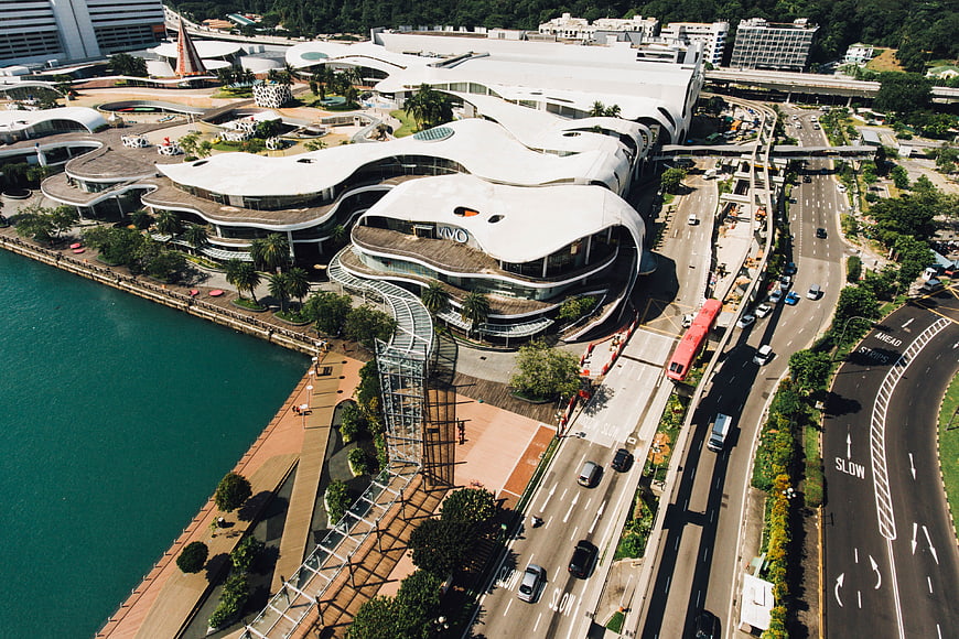 Aerial view of modern waterfront architecture and busy highway
