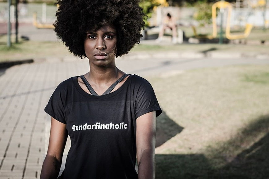 Woman with Afro Wearing Endorphinaholic T-Shirt