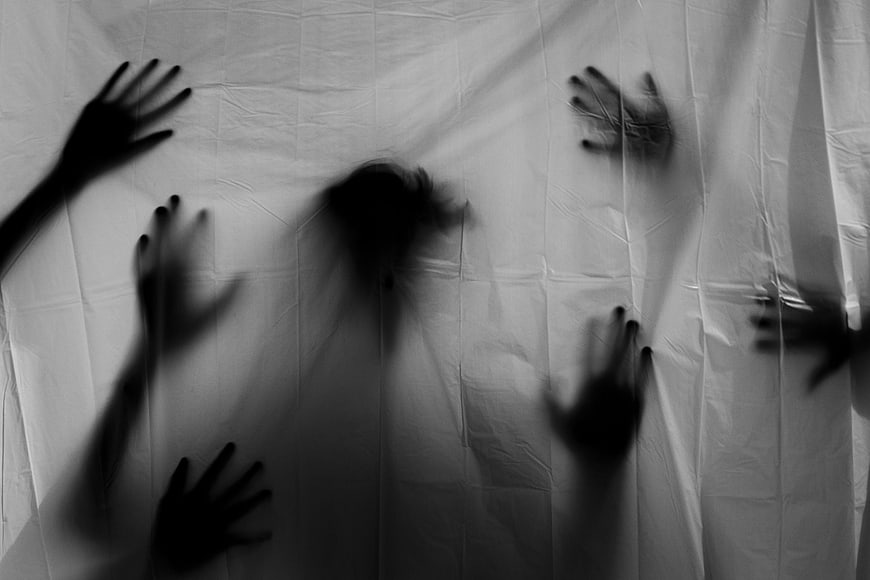 Scary Ghost Hands Pressing Against White Sheet Silhouette