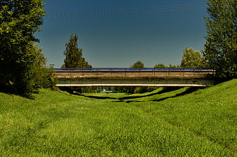 Concrete Railway Bridge Over Grassy Embankment