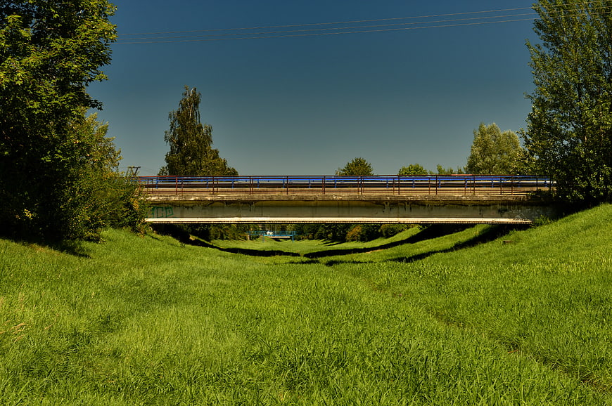 Concrete Railway Bridge Over Grassy Embankment