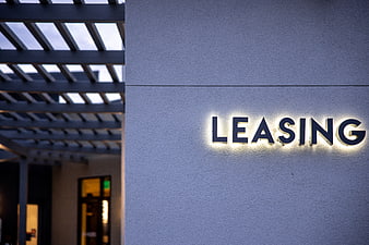 Illuminated Leasing Sign on Modern Building Exterior