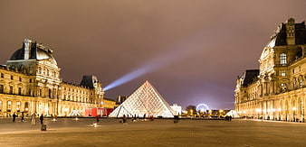 Louvre Museum Pyramid Illuminated at Night in Paris