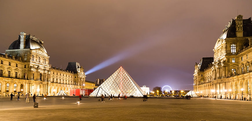 Louvre Museum Pyramid Illuminated at Night in Paris