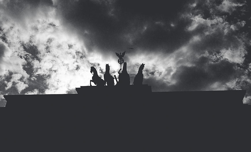 Silhouette of Quadriga Statue Against Dramatic Cloudy Sky