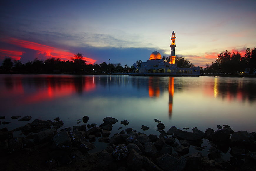 Istana Nur Mosque at Dusk with Red Sky Reflection