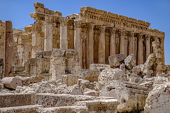 Ancient Roman Temple Ruins With Columns And Stone Debris