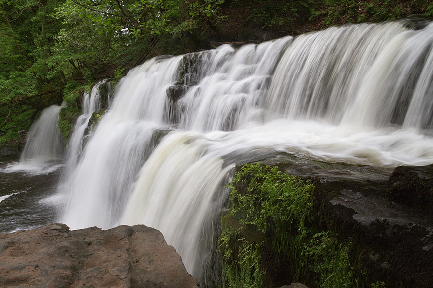 Serene Forest Waterfall with Smooth Flowing Water