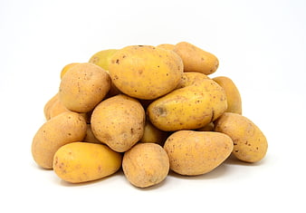 Pile of fresh yellow potatoes on white background