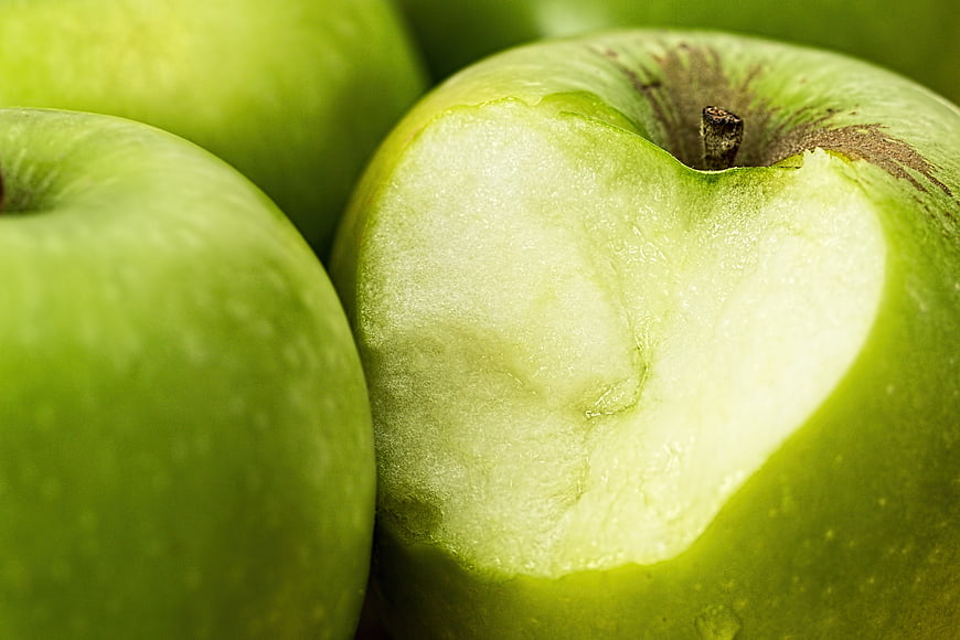 Close-up of Green Apple with Fresh Bite Mark