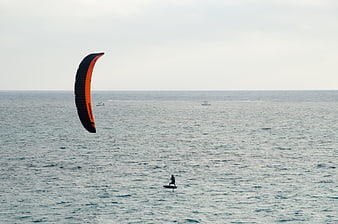 Kite Surfer Gliding on Calm Ocean Waters