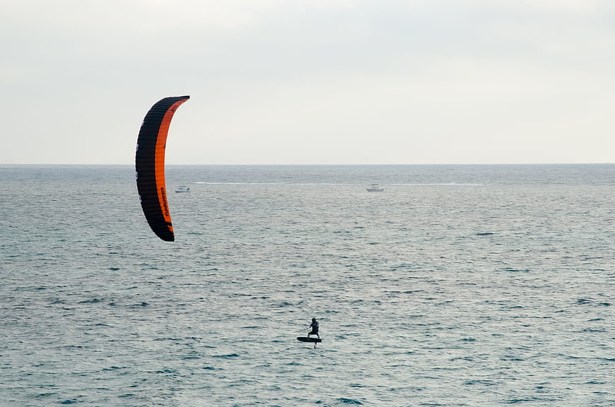 Kite Surfer Gliding on Calm Ocean Waters
