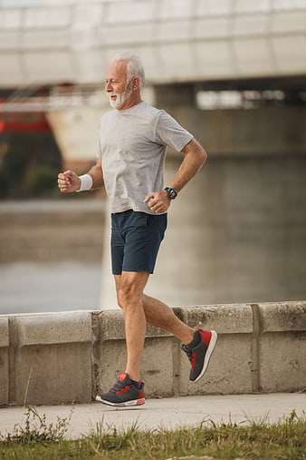 Senior Man Running Outdoors by River