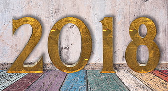 Golden 2018 Numbers on Vintage Wooden Background