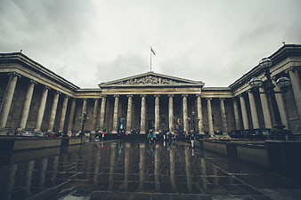 British Museum facade on rainy day with reflections
