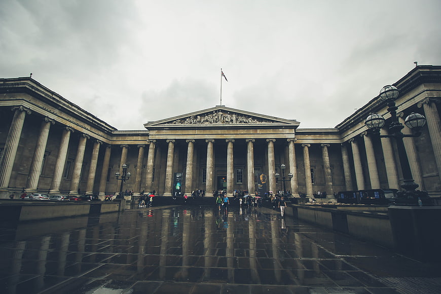British Museum facade on rainy day with reflections