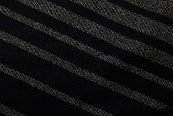 Close-up of black and gray striped woven fabric texture