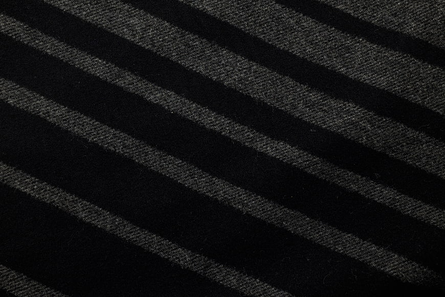 Close-up of black and gray striped woven fabric texture