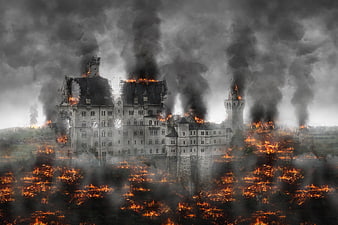 Dramatic castle engulfed in flames and thick smoke