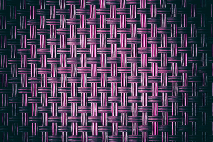 Close-up of purple woven wicker texture background