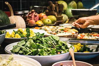 Healthy vegetarian salad buffet with fresh greens and vegetables