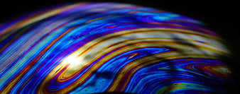 Macro Soap Bubble With Vivid Iridescent Colors And Abstract Swirls
