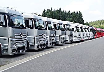Fleet of Silver Mercedes Trucks Parked in a Row