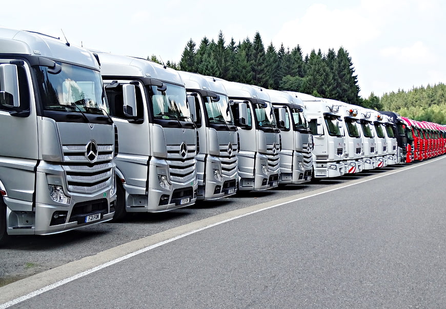 Fleet of Silver Mercedes Trucks Parked in a Row