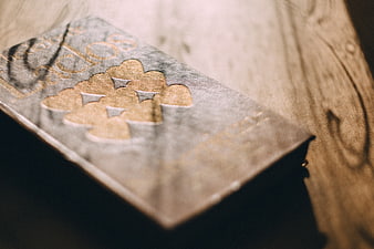 Vintage Book with Gold Cloud Design on Wooden Table