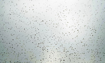 Raindrops on Glass Window Background