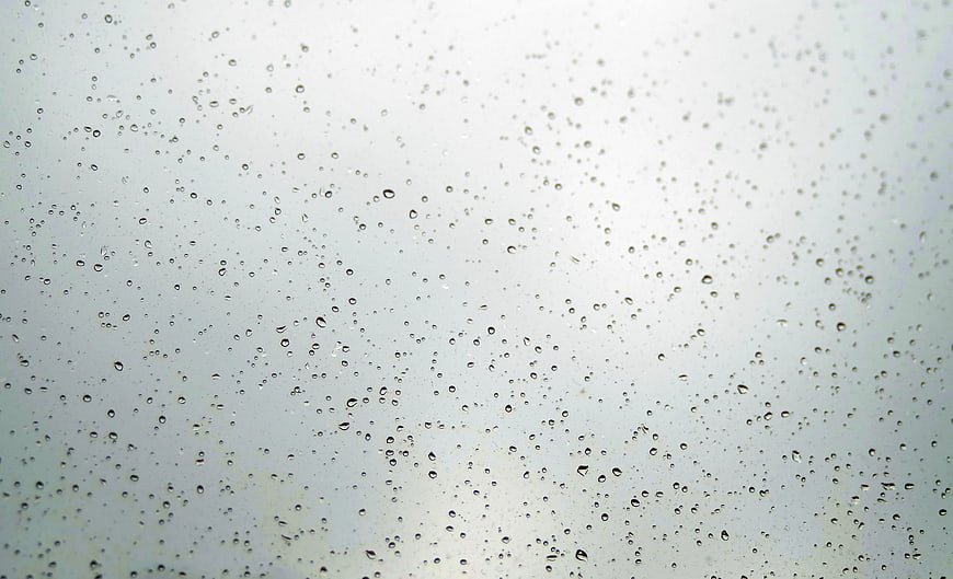 Raindrops on Glass Window Background
