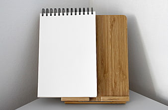 Blank Spiral Notebook on Wooden Stand Mockup
