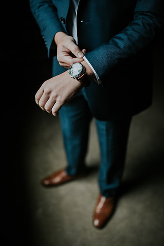 Man in Blue Suit Checking Wristwatch
