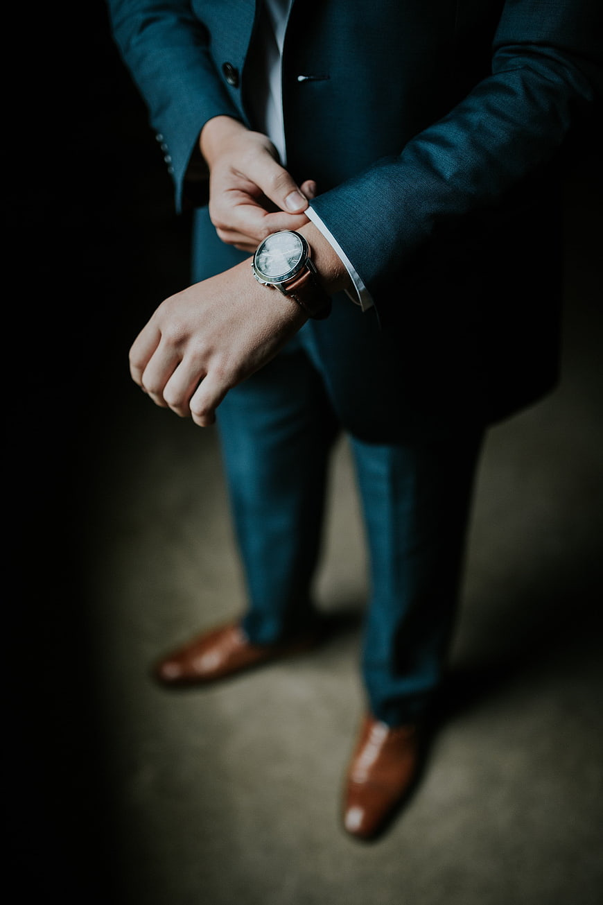 Man in Blue Suit Checking Wristwatch