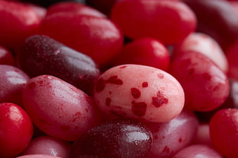 Close-up of colorful jelly beans with red and pink speckles