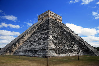 El Castillo Pyramid At Chichen Itza Under Blue Sky