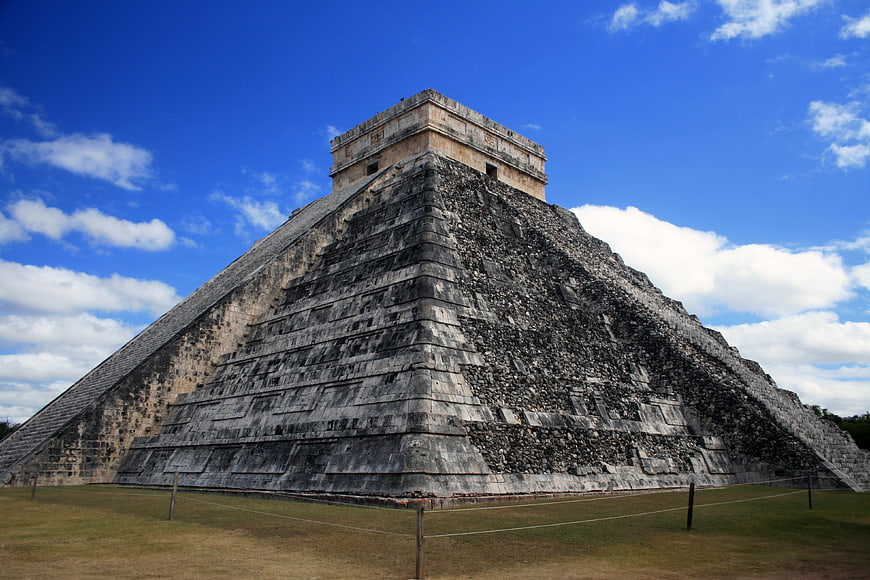 El Castillo Pyramid At Chichen Itza Under Blue Sky