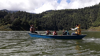 Group of tourists boating on a lake in Nepal