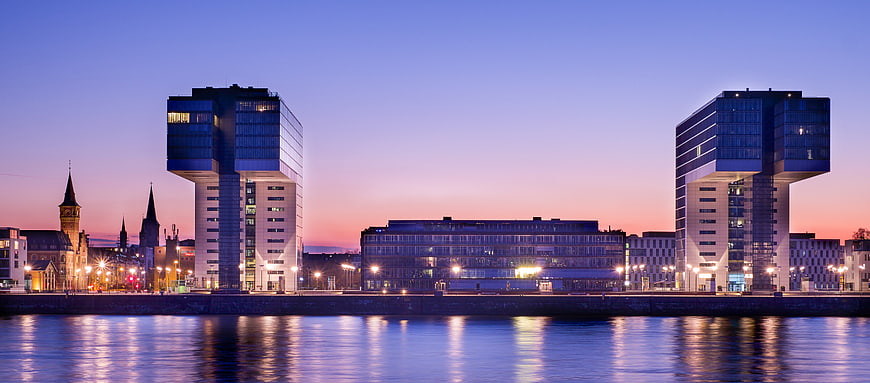 Panoramic View of Modern Architecture at Dusk by the Water