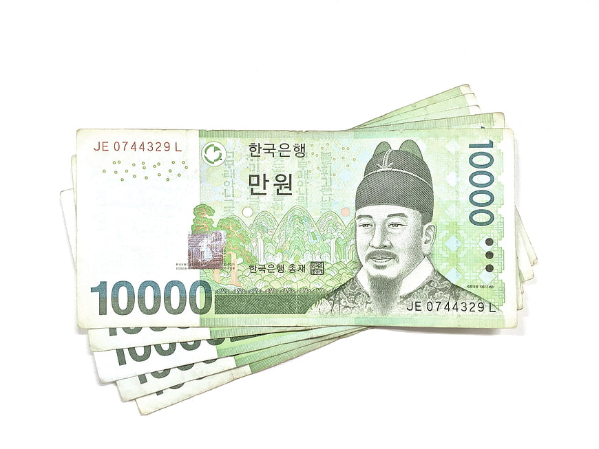 Fan of South Korean 10,000 Won Banknotes on White Background