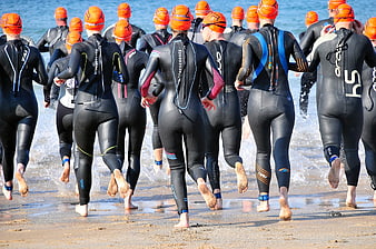 Triathletes Running into Ocean for Swim Race