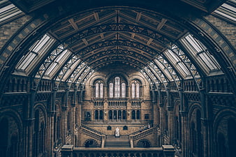 Grand Victorian Hall Interior with Arched Glass Roof and Staircase