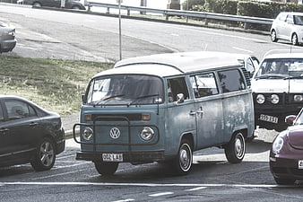 Vintage Blue Volkswagen Vanagon in Traffic