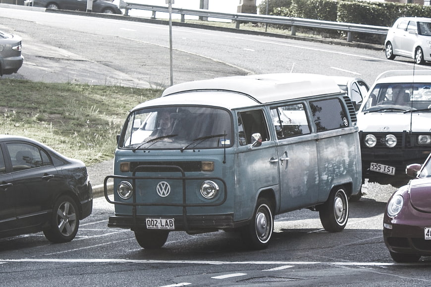Vintage Blue Volkswagen Vanagon in Traffic