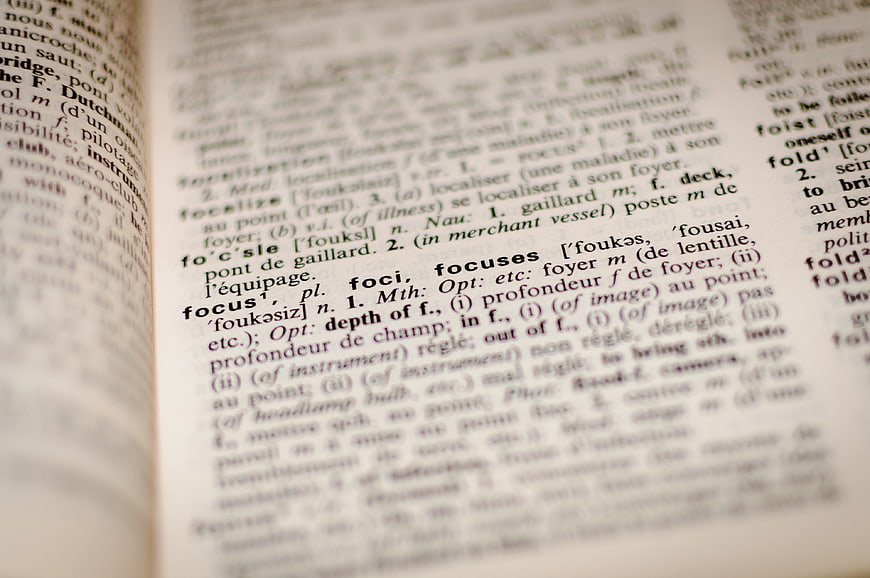 Close-up of dictionary page with word focus in sharp detail