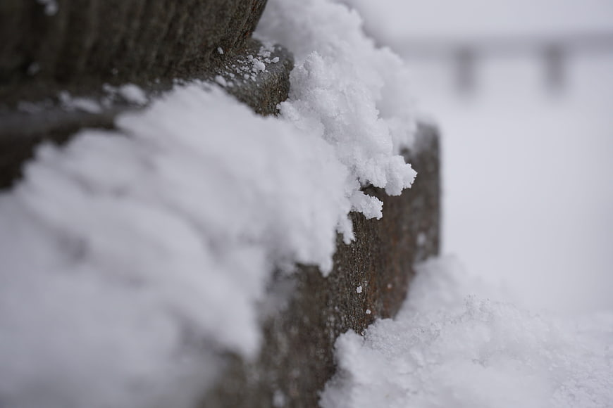Close-up of snow-covered stone steps in winter