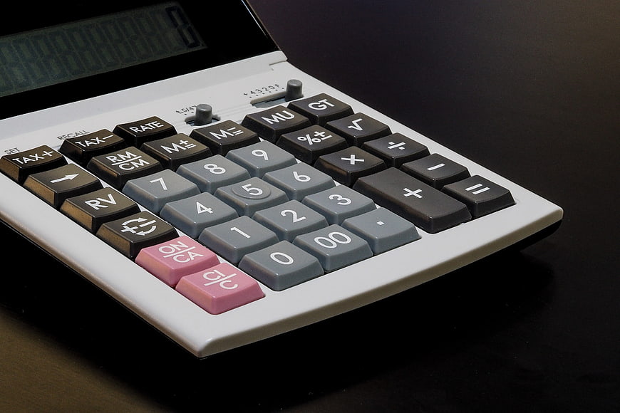 Close-up of a desktop financial calculator with numeric keypad